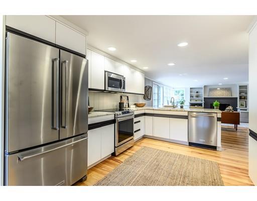 234 Highland Road Andover, MA 01810 - Photo 6 of 29 a large kitchen with a refrigerator and a stove top oven