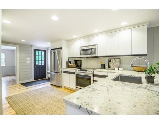 234 Highland Road Andover, MA 01810 - Photo 7 of 29 a kitchen with stainless steel appliances kitchen island granite countertop a sink and cabinets