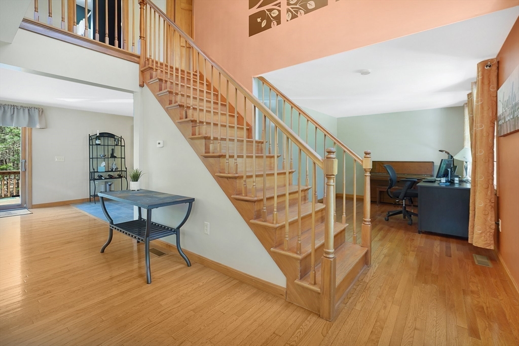 103 Ames Road Hampden, MA 01036 - Photo 4 of 42 a view of a livingroom with furniture hardwood floor and staircase