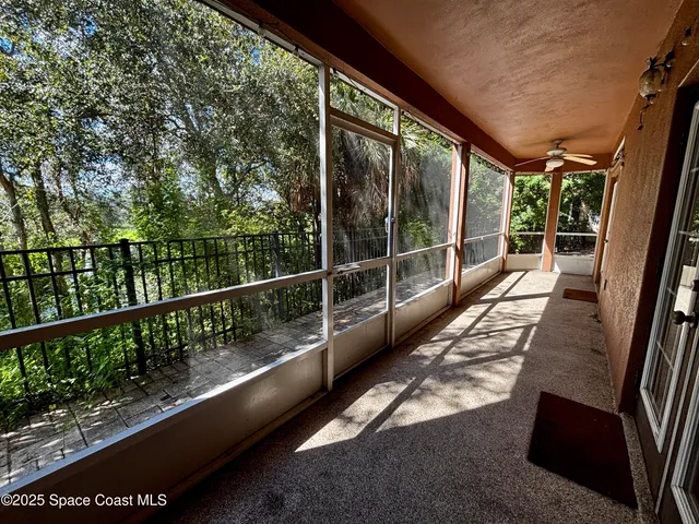 a view of a balcony with wooden floor