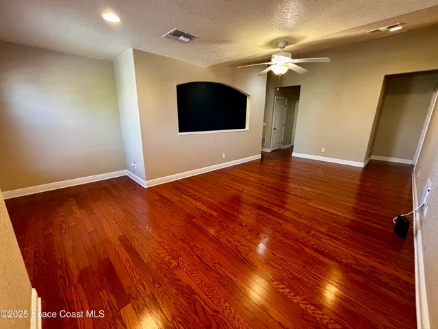 a view of a livingroom with wooden floor