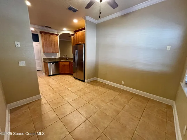 a view of a refrigerator and microwave