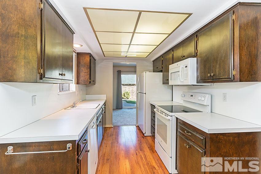 1895 Prince Way Reno, NV 89503 - Photo 6 of 17 a kitchen that has a lot of cabinets a sink and wooden floor