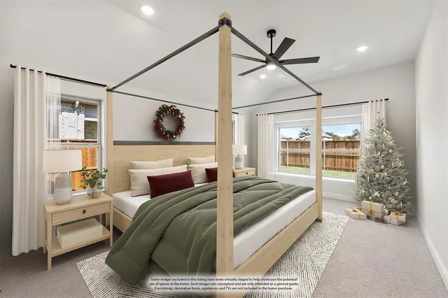 a bedroom with a bed and glass walk in closet