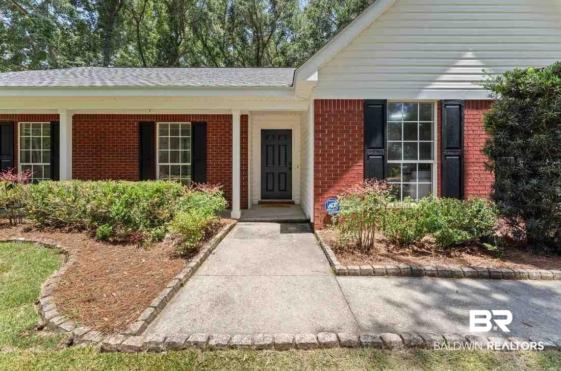 10251 Windmill Road Fairhope, AL 36532 - Photo 7 of 44 Doorway to property with brick siding and a shingled roof
