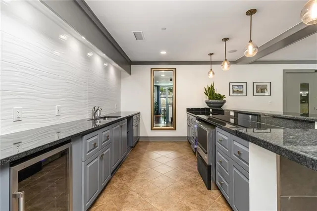 a large kitchen with stainless steel appliances granite countertop plenty of counter space
