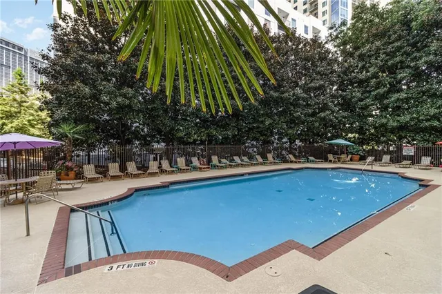 a view of a swimming pool with a patio
