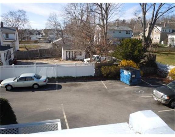 325 Mammoth Road, Unit 4 Lowell, MA 01854 - Photo 6 of 29 a view of a street with cars
