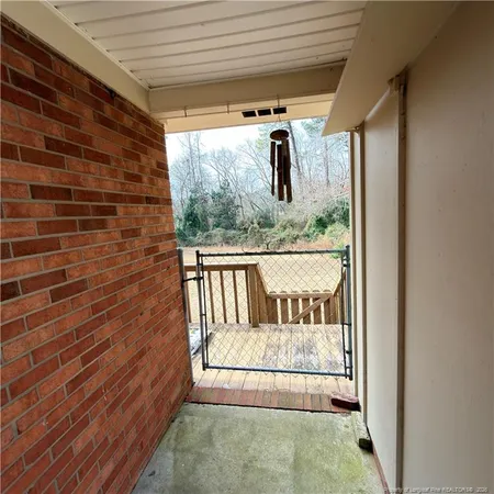 a backyard of a house with a yard and wooden fence