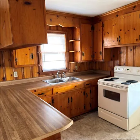 a kitchen with a stove and a sink