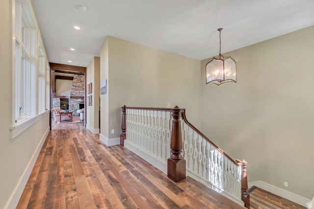2579 Splendor Valley Road Kamas, UT 84036 - Photo 84 of 87 Hall with hardwood / wood-style floors, an upstairs landing, and hanging lights
