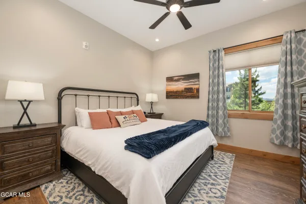 a bedroom with a large bed and a window