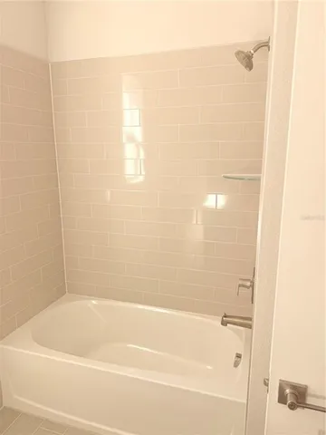 a bathroom with a sink a toilet and a window