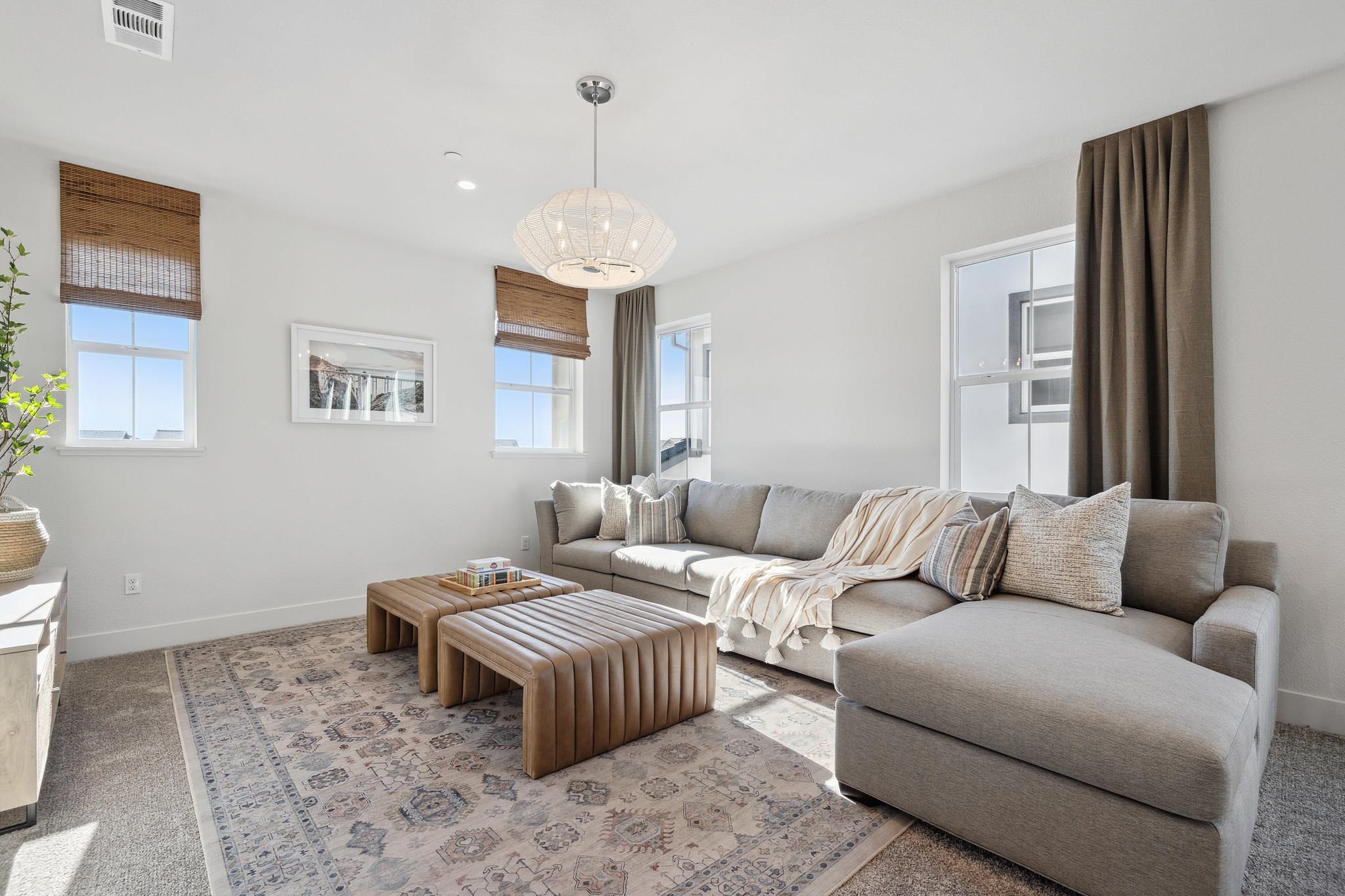 1516 Millennium Way Fairfield, CA 94533 - Photo 27 of 57 a living room with furniture wooden floor and a chandelier