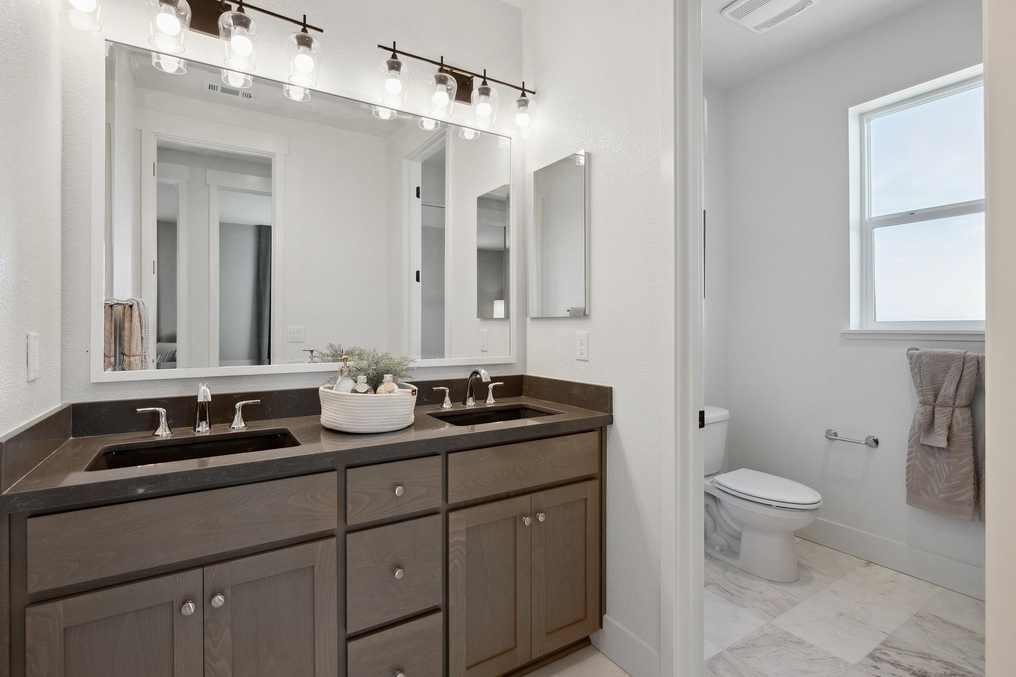 1516 Millennium Way Fairfield, CA 94533 - Photo 42 of 57 a bathroom with a double vanity sink and a mirror