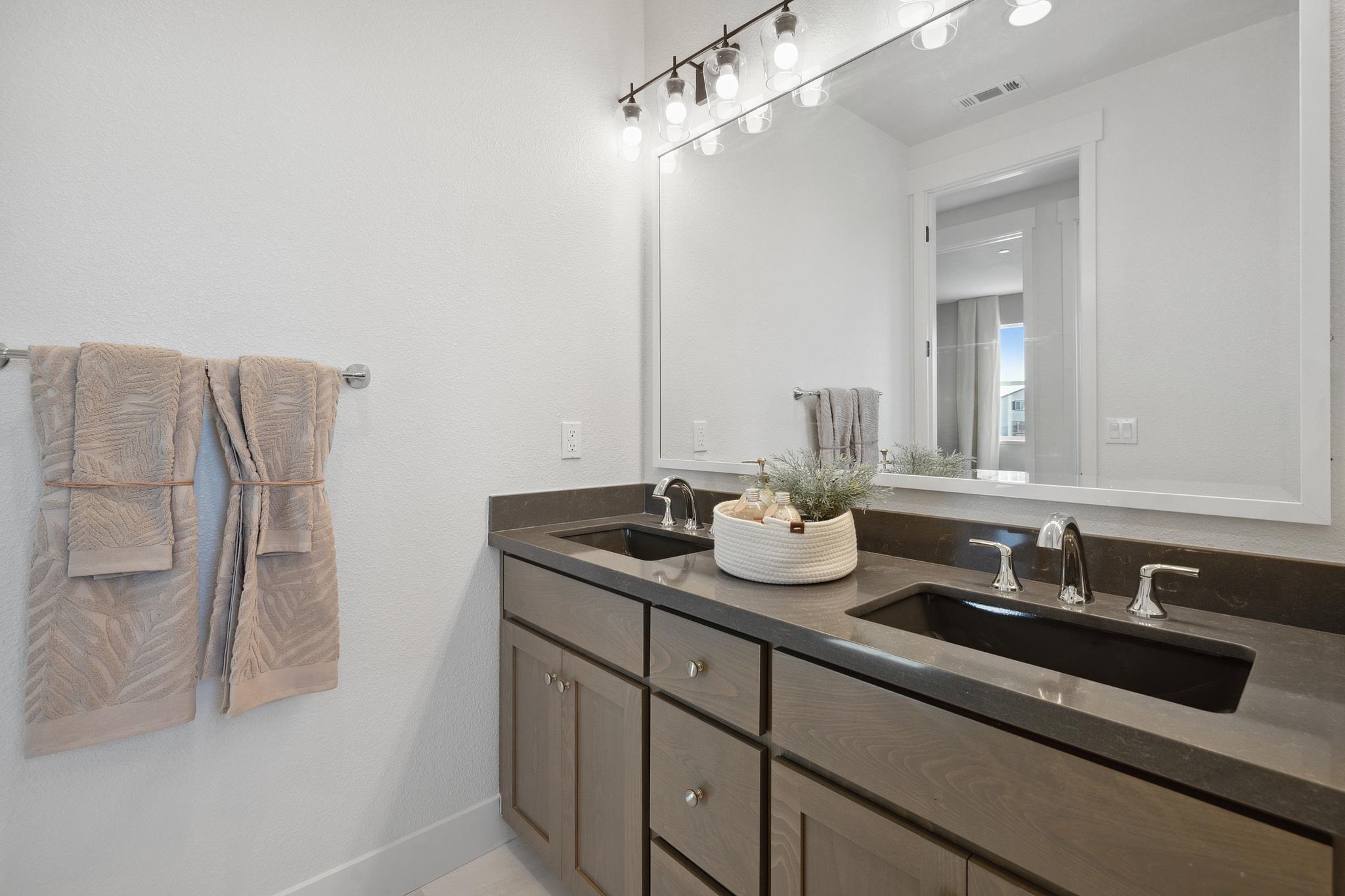 1516 Millennium Way Fairfield, CA 94533 - Photo 44 of 57 a bathroom with a sink and a mirror
