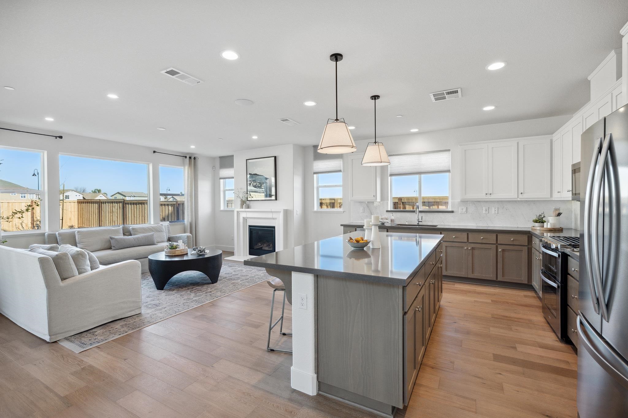 1516 Millennium Way Fairfield, CA 94533 - Photo 10 of 57 a large kitchen with cabinets a sink a counter space and stainless steel appliances