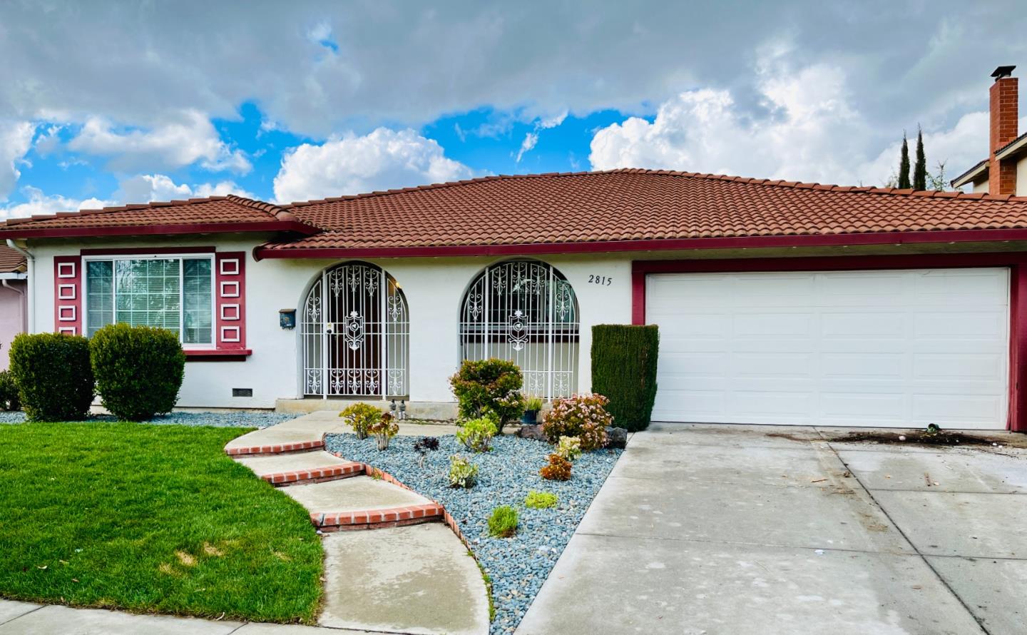 2815 Mabury Road San Jose, CA 95133 - Photo 1 of 4 a front view of a house with garden