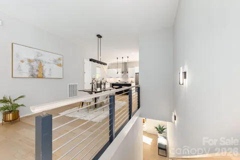 a kitchen with stainless steel appliances granite countertop a sink a stove top oven a counter space and cabinets