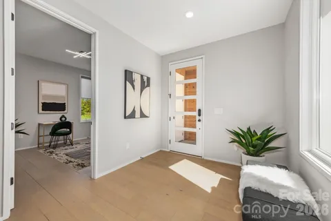 a view of livingroom with furniture and a potted plant