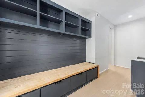 a kitchen with a sink a counter top space and a window