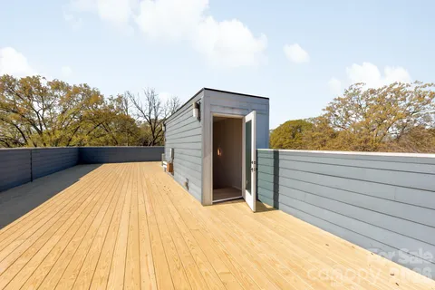a view of balcony with wooden floor