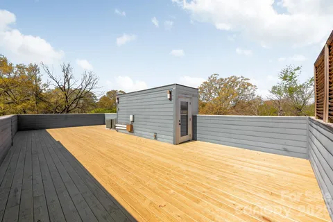 a view of balcony with wooden floor