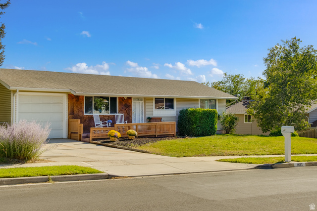 1482 Waters Lane Sandy, UT 84093 - Photo 1 of 1 Single story home with a shingled roof, a front yard, an attached garage, driveway, and covered porch