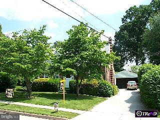 405 Paddock Road Havertown, PA 19083 - Photo 1 of 1 a garden with trees in front of it