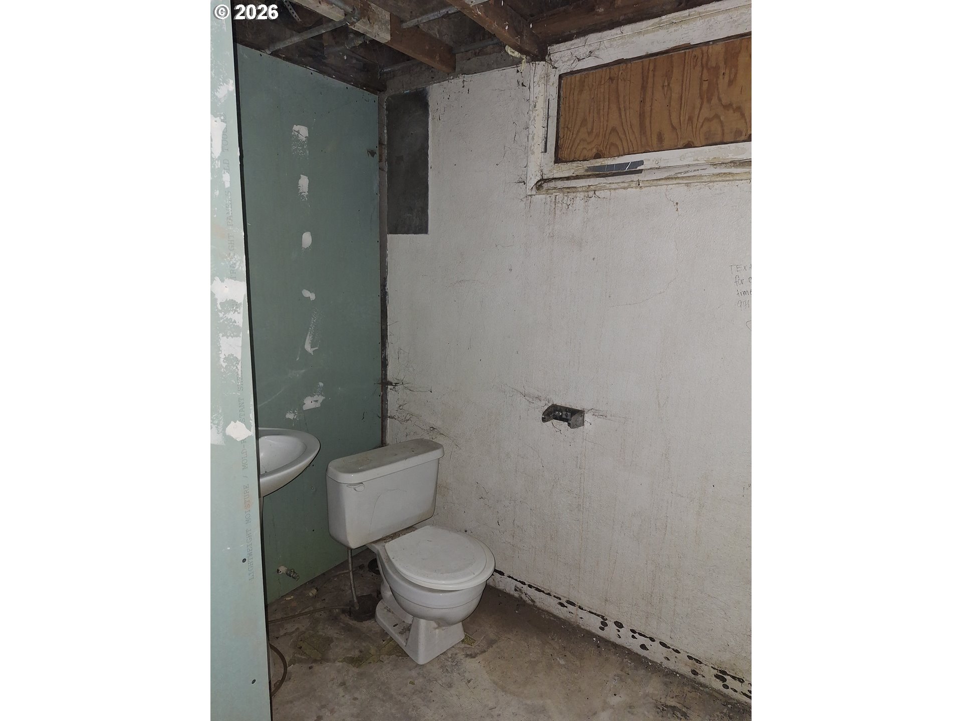 933 Southeast 174th Avenue Portland, OR 97233 - Photo 14 of 14 a white toilet sitting next to a bathroom sink