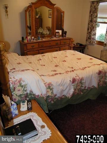 347 A Smoketown Road Hanover, PA 17331 - Photo 14 of 17 a bedroom with a bed and a mirror