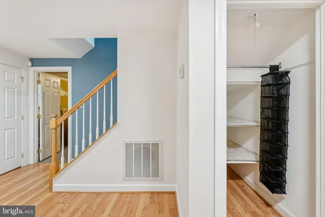 a view of staircase with white walls and a window