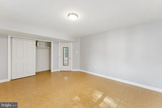 a view of an empty room and window