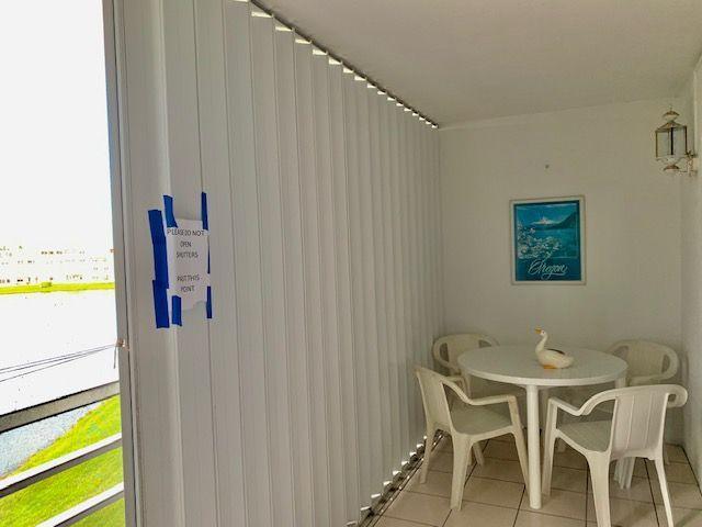 4080 Guildford East Boca Raton, FL 33434 - Photo 12 of 24 Screened Patio w/Accordion Shutters