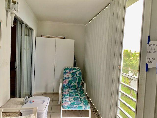 4080 Guildford East Boca Raton, FL 33434 - Photo 13 of 24 Screened Patio w/Accoridion Shutters