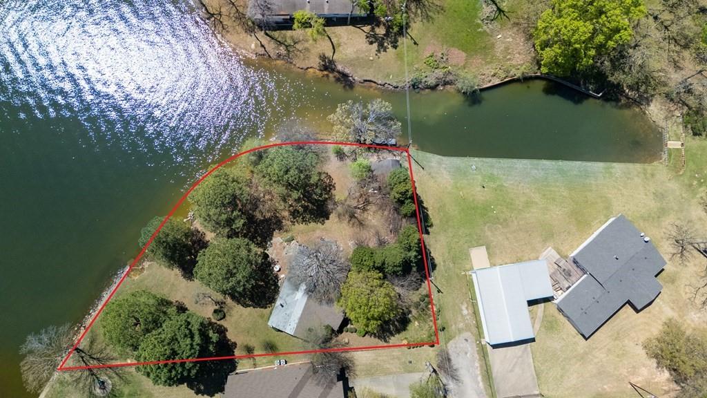 229 Esquire Estates Road Mabank, TX 75156 - Photo 16 of 19 an aerial view of a house with a yard and lake view