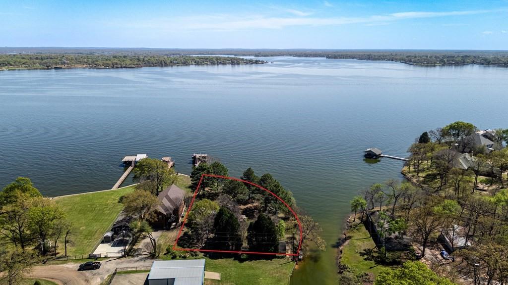 229 Esquire Estates Road Mabank, TX 75156 - Photo 5 of 19 a view of a lake with a nearby beach