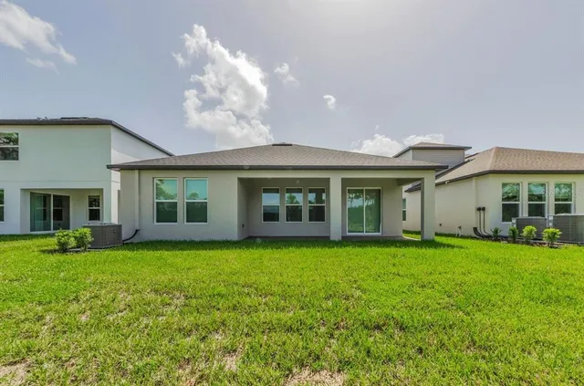 a view of a house with a garden and porch