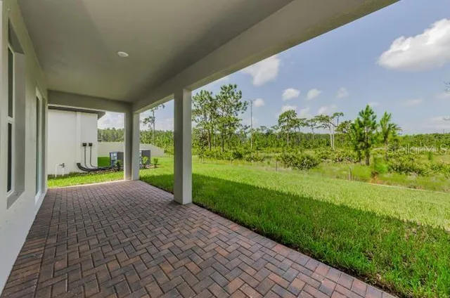 a view of a porch and garden