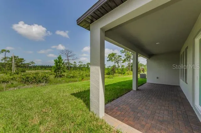 a view of a porch with a yard
