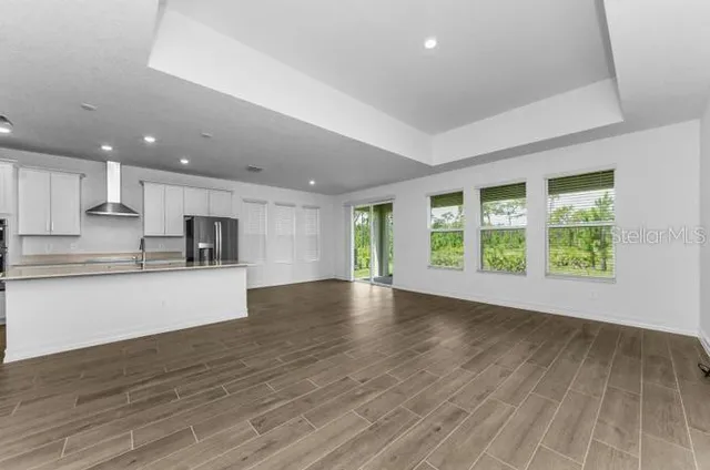 a view of kitchen with wooden floor and window