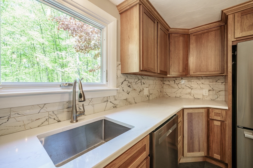 313 Bennett Road Hampden, MA 01036 - Photo 14 of 42 a kitchen with a sink cabinets and window