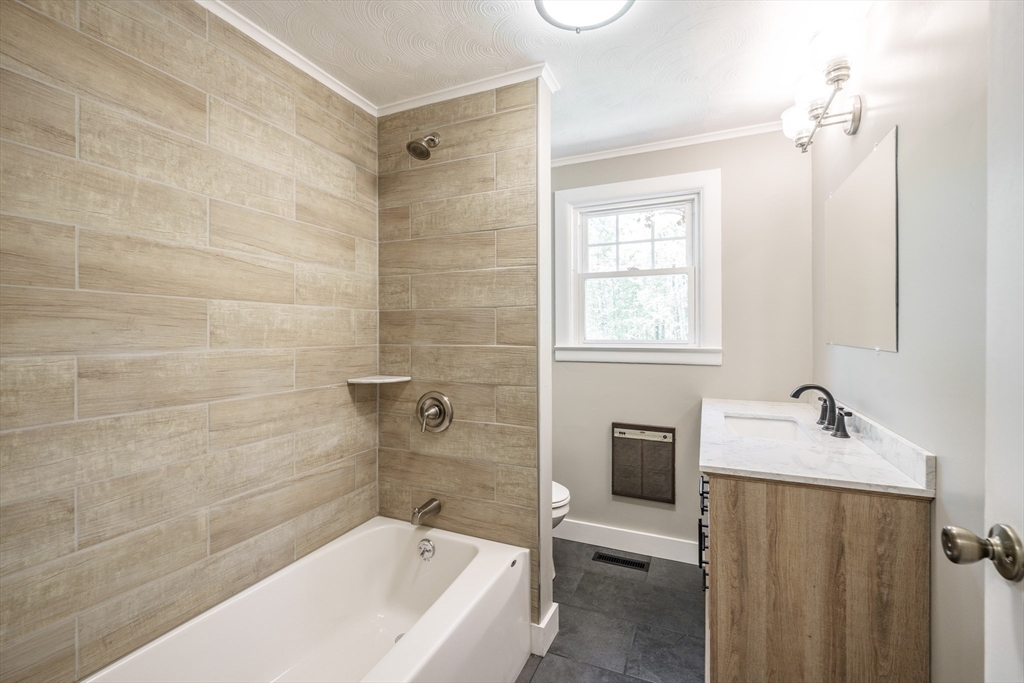 313 Bennett Road Hampden, MA 01036 - Photo 21 of 42 a bathroom with a sink and bathtub