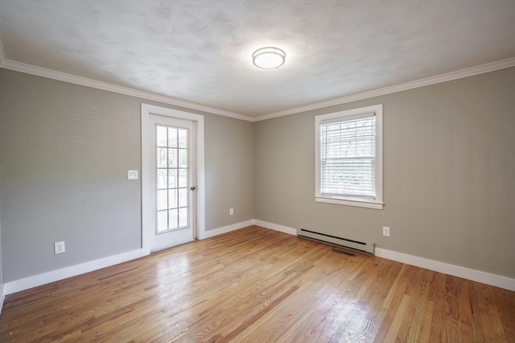 313 Bennett Road Hampden, MA 01036 - Photo 24 of 42 an empty room with wooden floor and windows