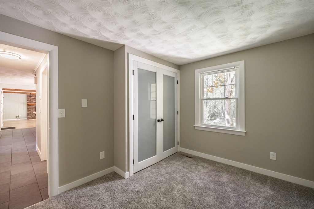 313 Bennett Road Hampden, MA 01036 - Photo 25 of 42 an empty room with windows and closet
