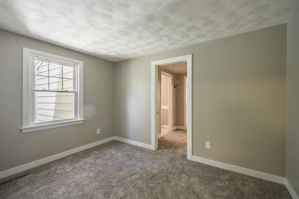 313 Bennett Road Hampden, MA 01036 - Photo 26 of 42 an empty room with windows and closet