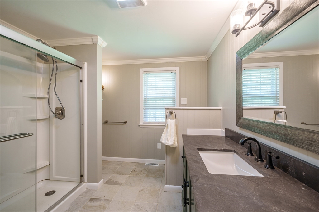 313 Bennett Road Hampden, MA 01036 - Photo 27 of 42 a spacious bathroom with a granite countertop sink a toilet and shower