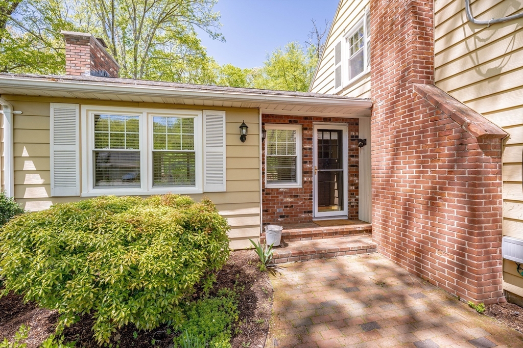 313 Bennett Road Hampden, MA 01036 - Photo 3 of 42 front view of a brick house with a large window