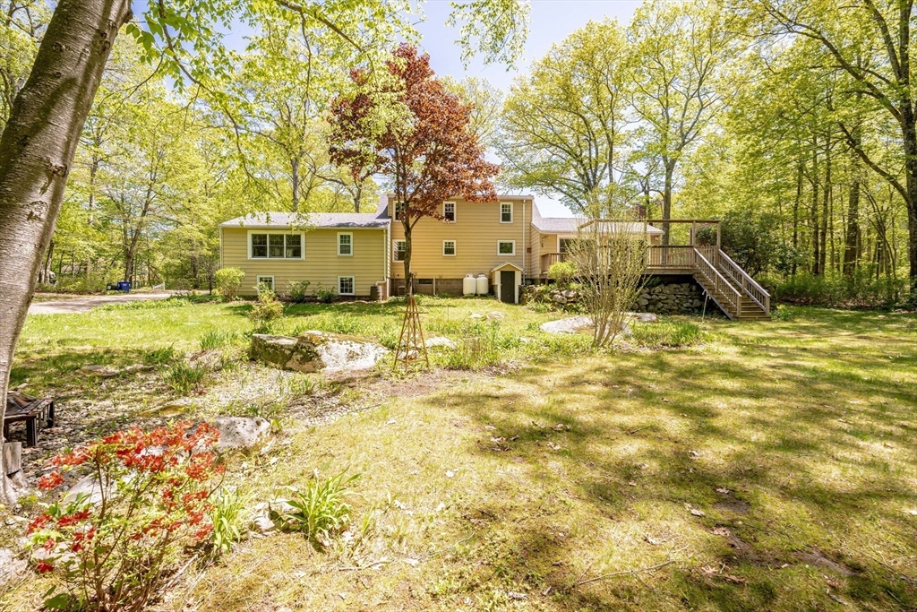 313 Bennett Road Hampden, MA 01036 - Photo 41 of 42 a view of a yard with a house in the background