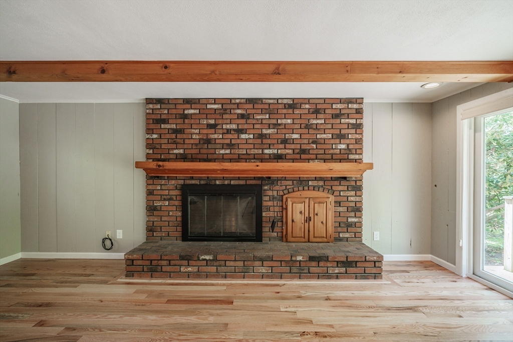 313 Bennett Road Hampden, MA 01036 - Photo 7 of 42 a view of fireplace and wooden floor